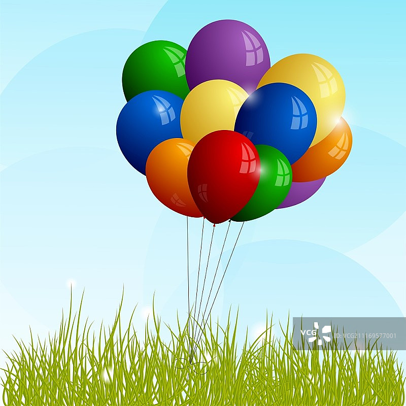 绿色草地上的彩色气球图片素材