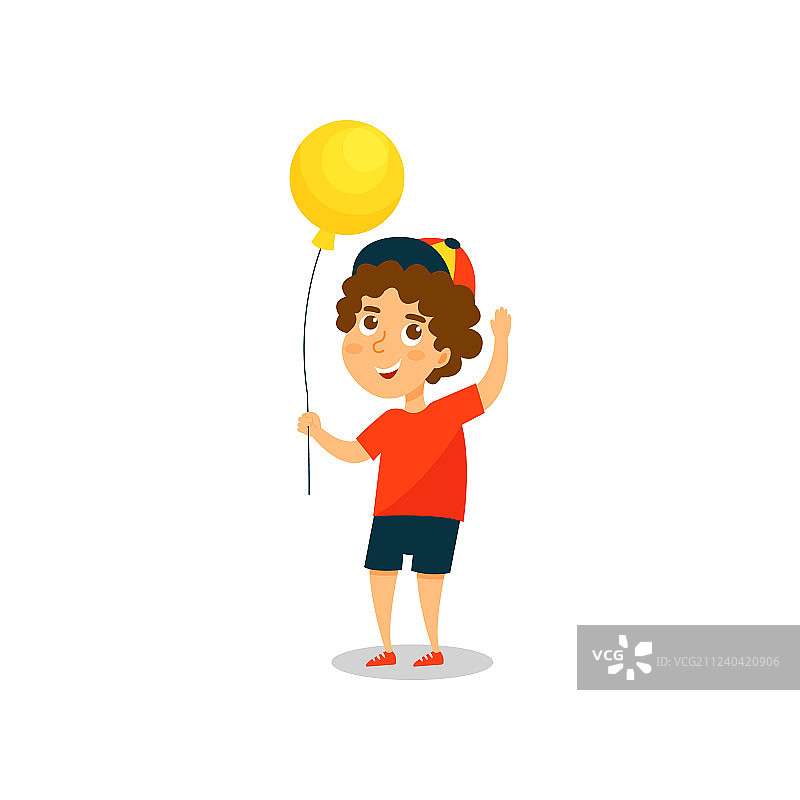 可爱的小男孩拿着黄色的气球图片素材