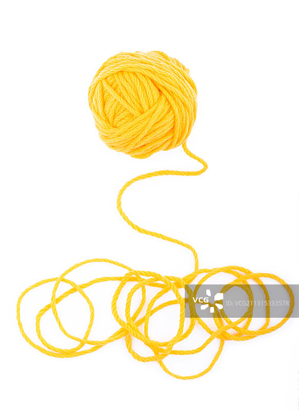 特写的黄色羊毛球对白色的背景图片素材
