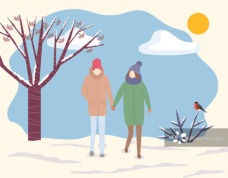 一对夫妇在寒冷的天气穿过冬天的公园图片素材
