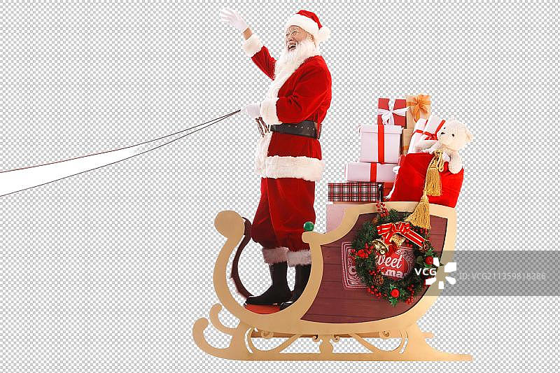穿着圣诞服的老人站在雪橇上招手图片素材