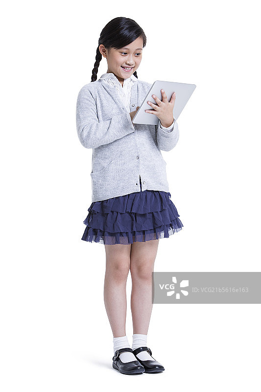 小女孩和平板电脑图片素材