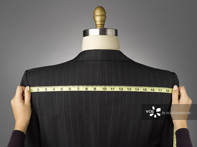 女性测量夹克对男性服装形式图片素材