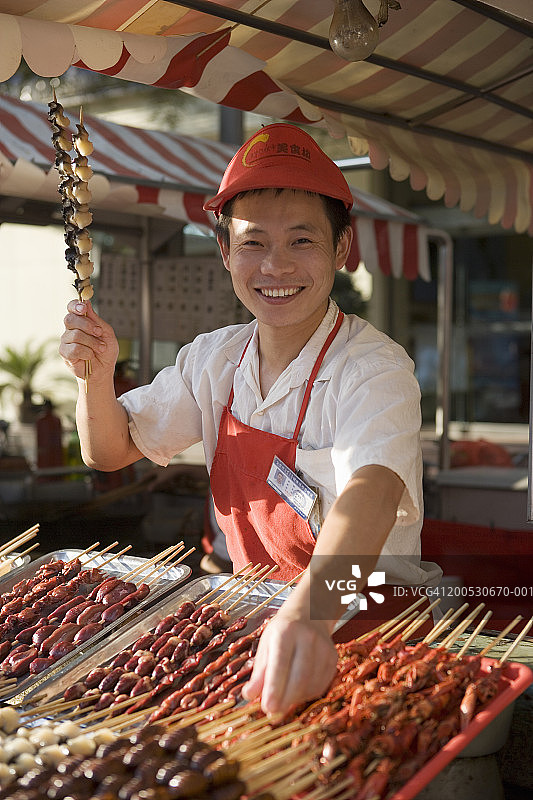 中国，北京，女人经营小吃摊，肖像图片素材