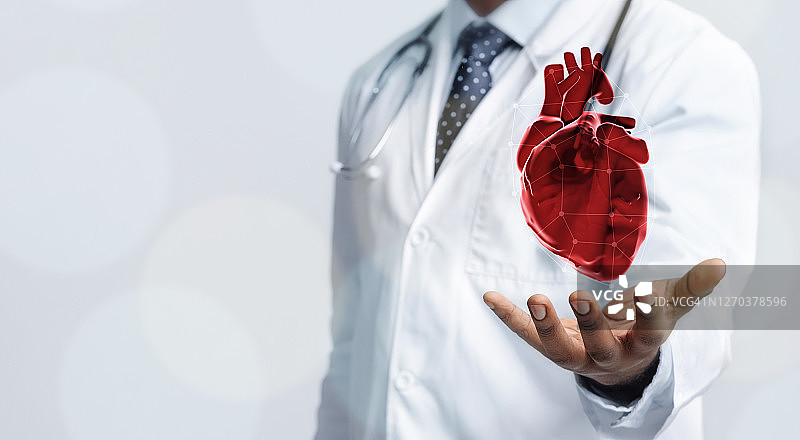 身穿大衣的医生手持虚拟心脏的插图图片素材