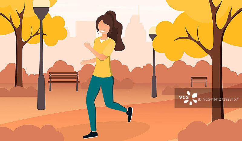 秋天，年轻女子在公园慢跑图片素材