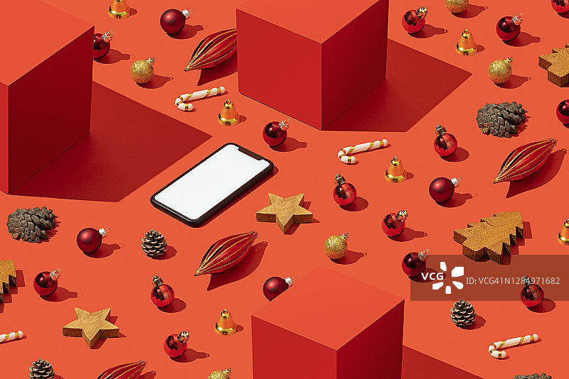 圣诞概念平躺与智能手机模型，模板在红色的背景图片素材