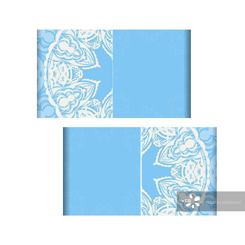蓝色的小册子上有一个白色图案的曼荼罗，可以印刷了。图片素材