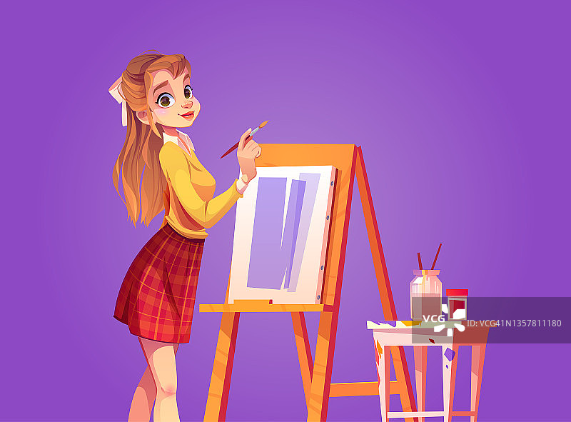 女孩画家用画笔在画布上作画图片素材