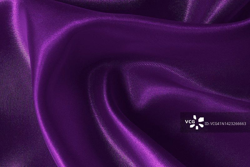紫色织物为织物质地的背景和设计艺术作品，美丽的褶皱图案的丝绸或亚麻。图片素材