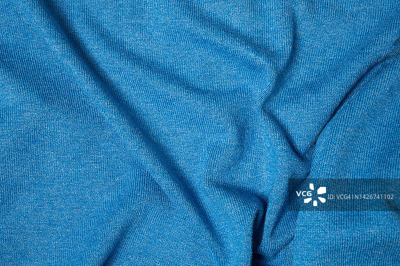 蓝色面料和涤纶面料面料的质感和纺织背景。图片素材