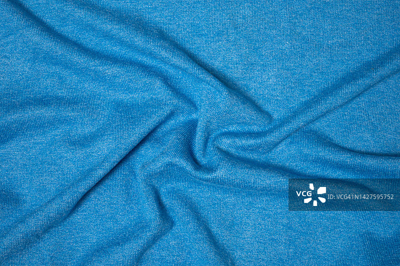 蓝色面料和涤纶面料面料的质感和纺织背景。图片素材