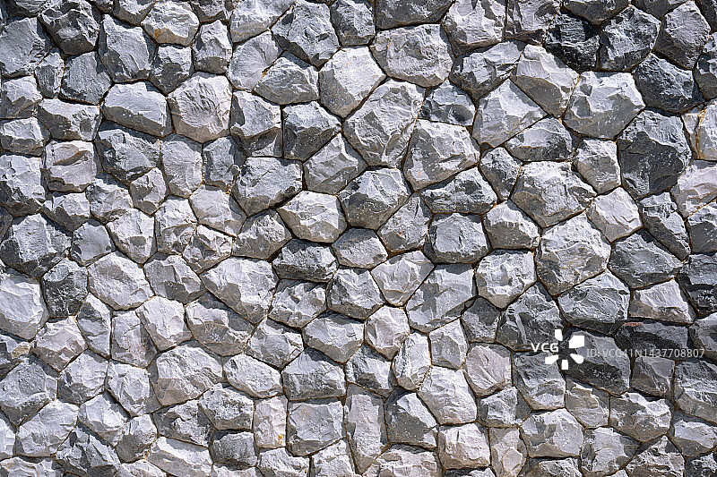不同形状的砖墙，灰色的石头背景。图片素材