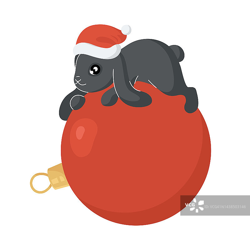 一只黑兔子躺在圣诞球上。图片素材