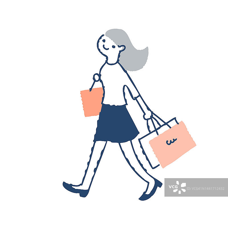 年轻女子拿着购物袋走路图片素材