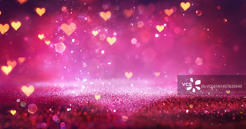 情人节-粉红色闪光与心灯在抽象散焦背景-图片素材