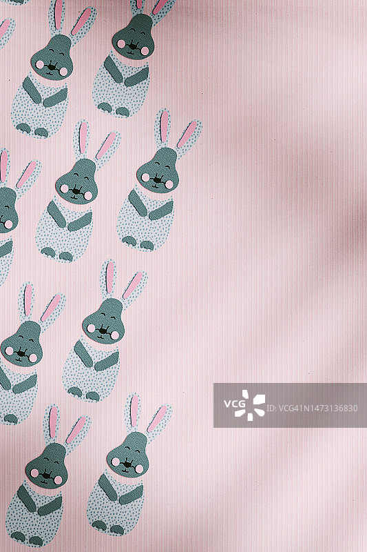 复活节兔子无缝图案在粉红色图片素材