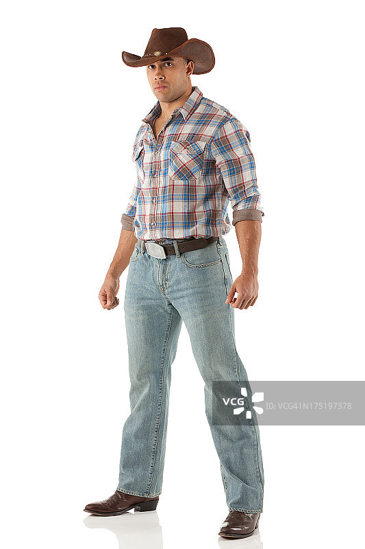 一个牛仔摆姿势的肖像图片素材
