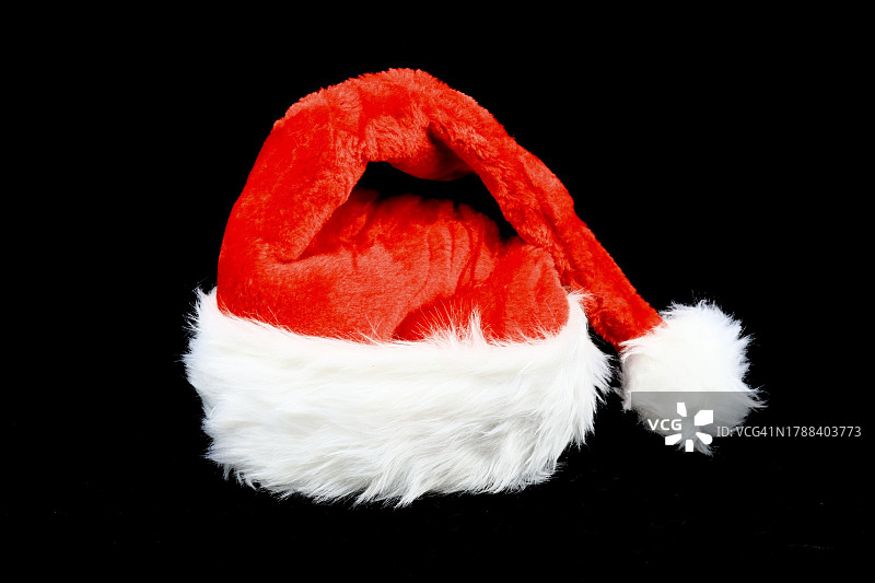给圣诞老人的红白相间的毛帽子图片素材