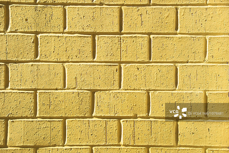 明亮脆黄砖墙全框架水平图片素材