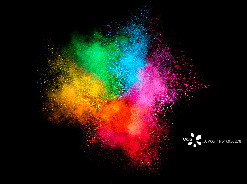 彩色尘埃粒子爆炸孤立在黑色背景图片素材