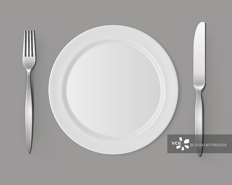 白色空扁圆盘叉刀餐桌设置图片素材
