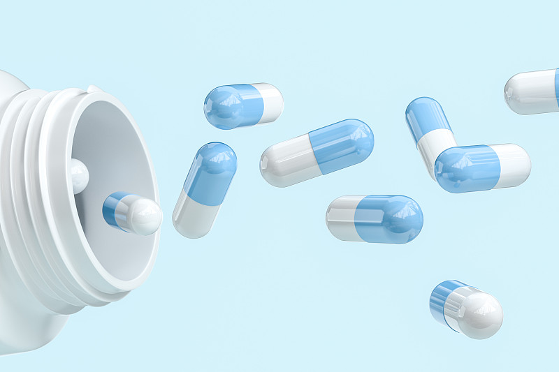 蓝色药丸与白色药瓶，三维渲染图片下载