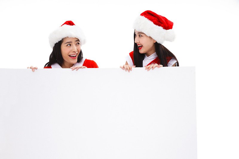 穿圣诞服的年轻女人拿着白板图片下载