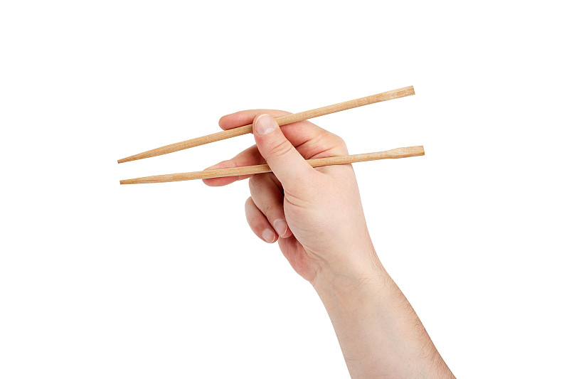 男子用筷子吃寿司，孤立在白色背景上图片素材