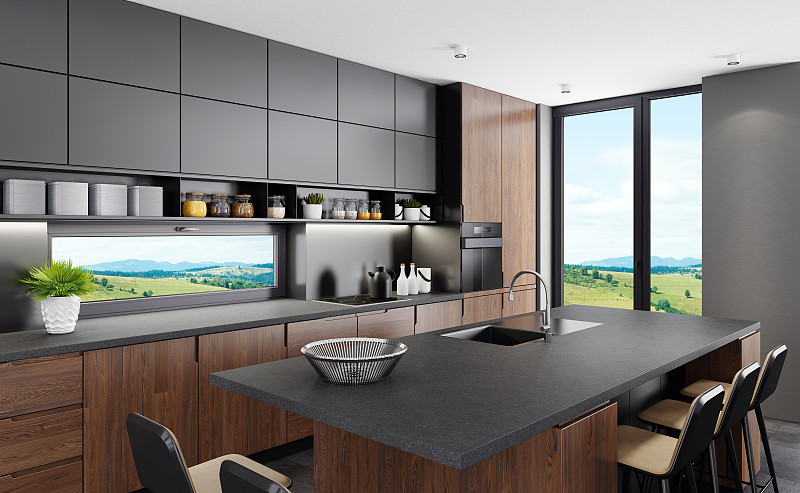 新鲜的哑光黑色厨房与英国橡木橱柜和岛桌在乡村的背景图片素材