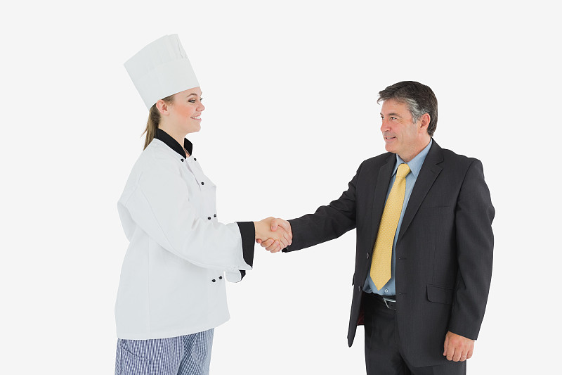 商人和女厨师握手图片下载