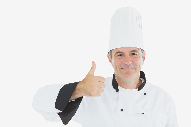 穿着制服的成熟厨师竖起大拇指图片素材