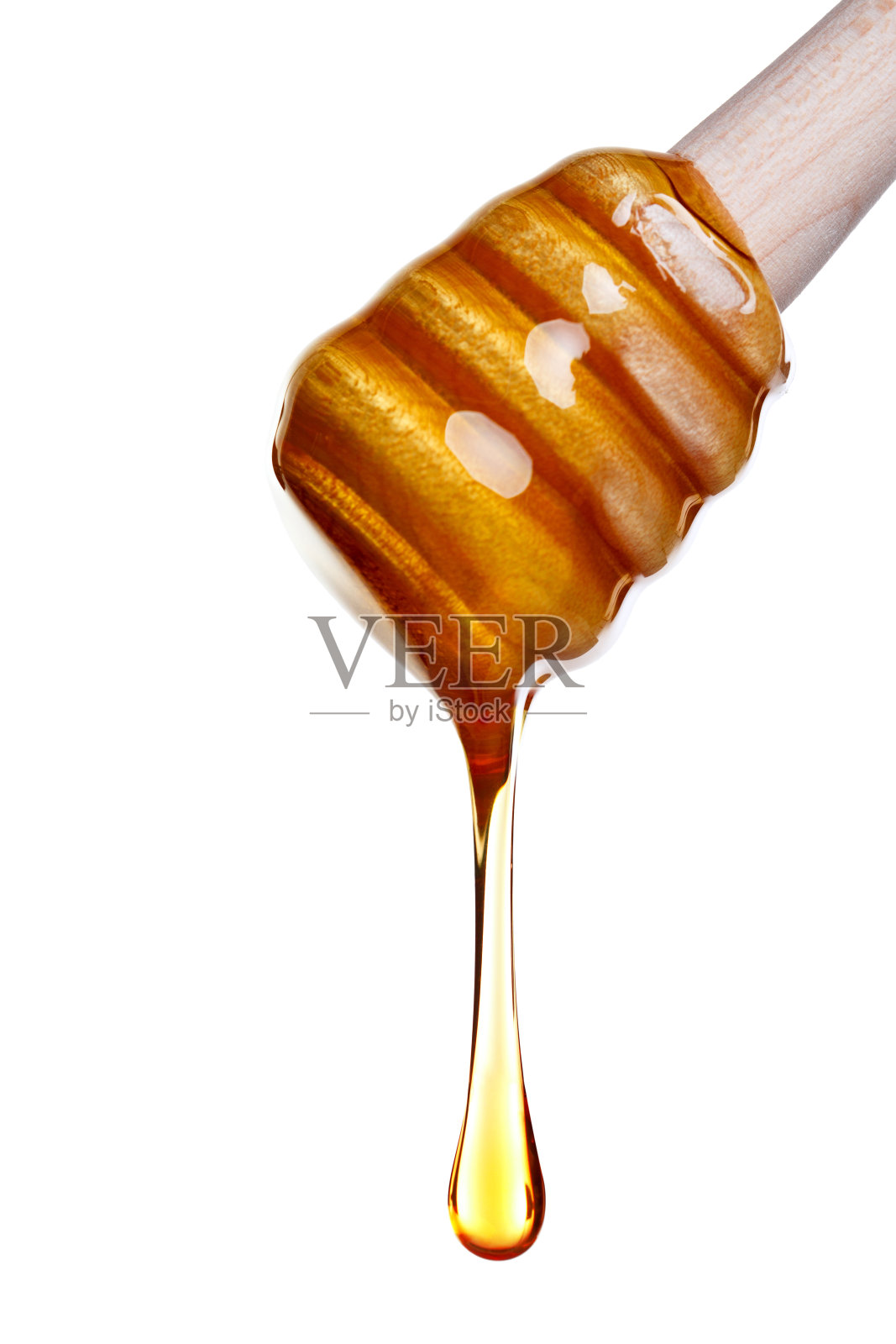 蜂蜜从木勺上滴下来照片摄影图片