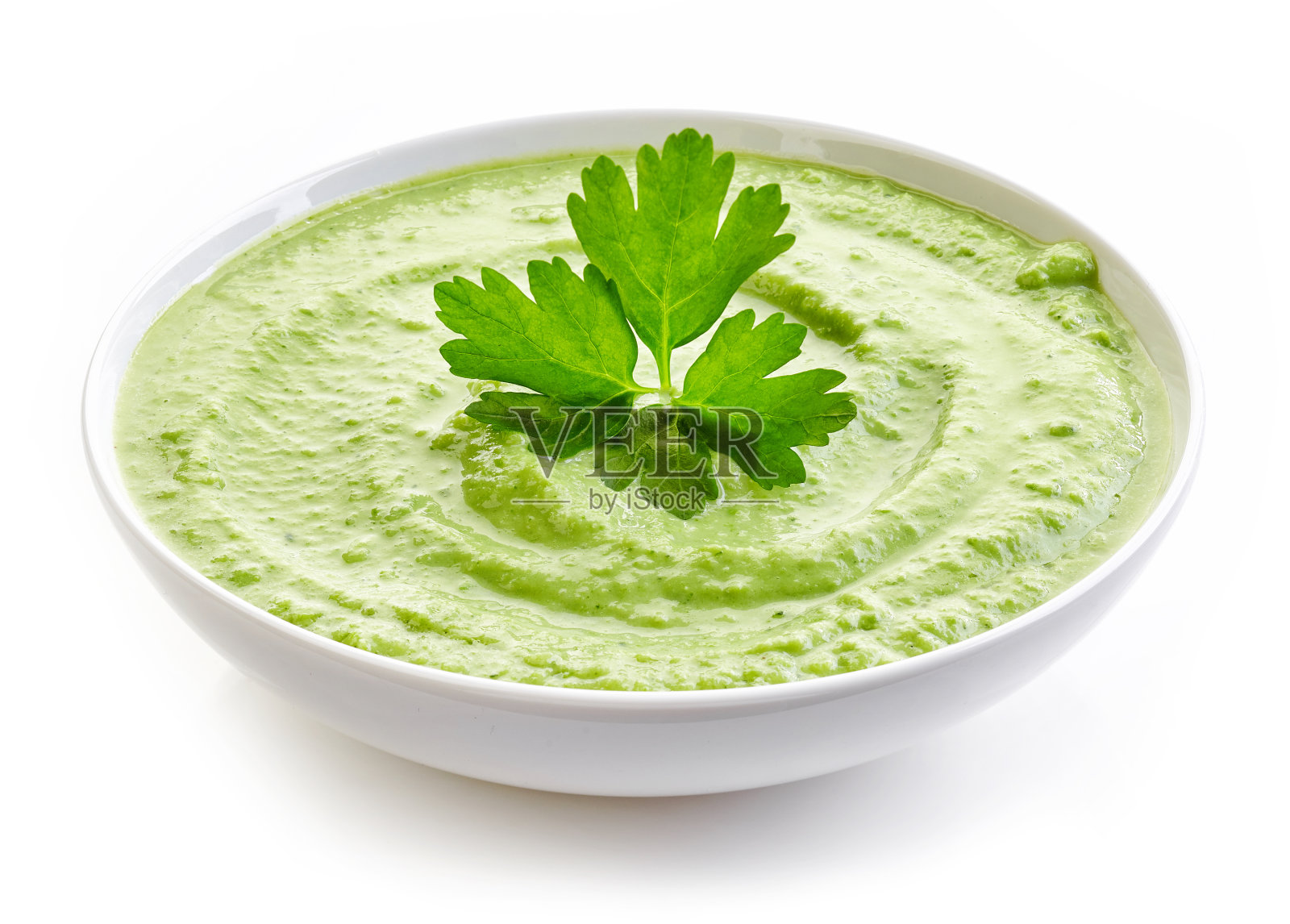 一碗西兰花和绿豌豆奶油汤照片摄影图片