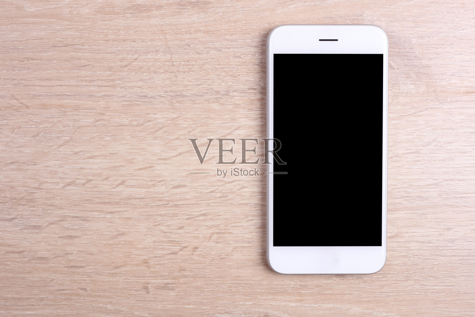 木色背景上的空白屏幕智能手机照片摄影图片