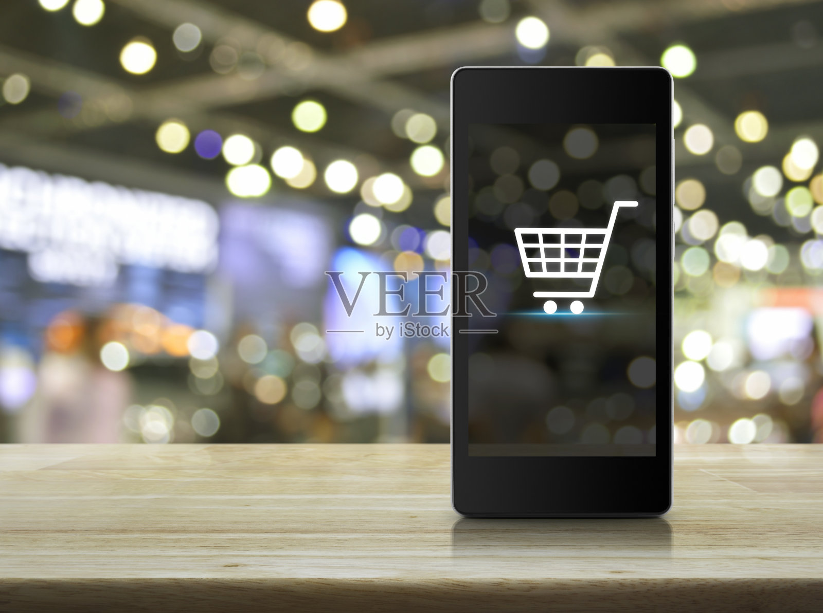 购物车图标在智能手机屏幕上模糊购物中心照片摄影图片
