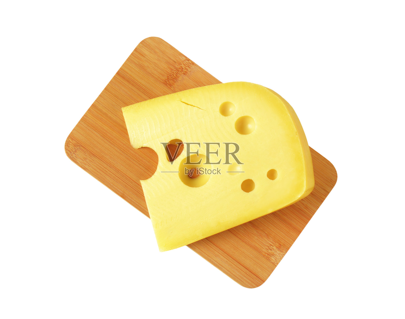 楔形的带眼睛的黄色奶酪照片摄影图片