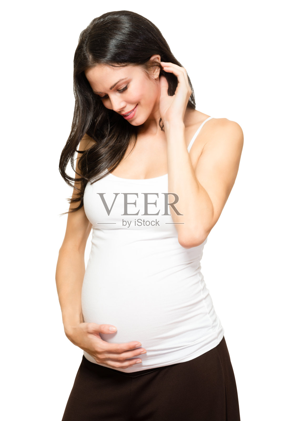 孕妇抱着肚子上的白色照片摄影图片