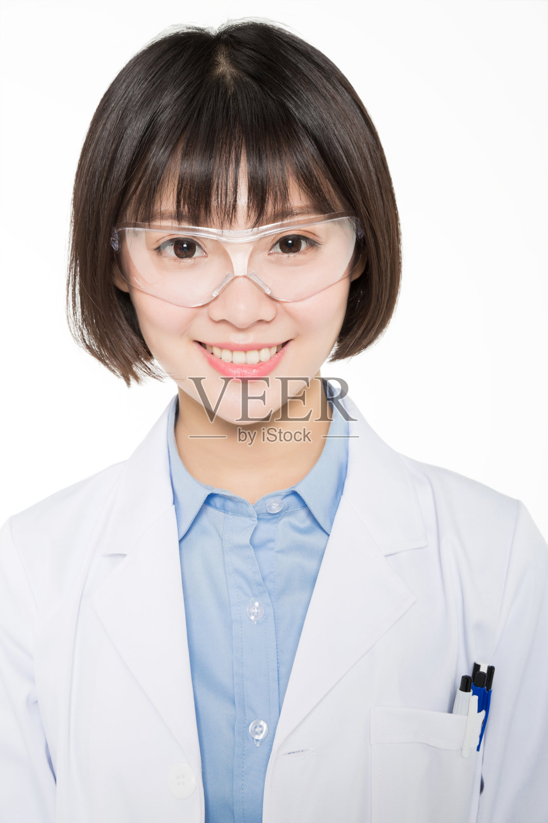 戴着防护眼镜的年轻女性实验室的肖像照片摄影图片