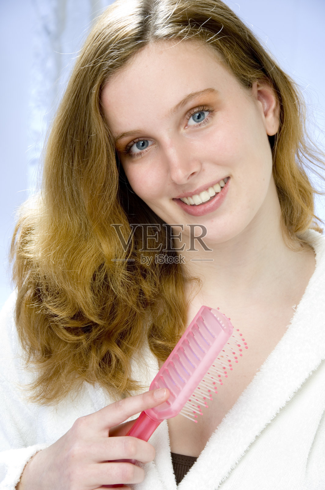 年轻女子梳着金发照片摄影图片