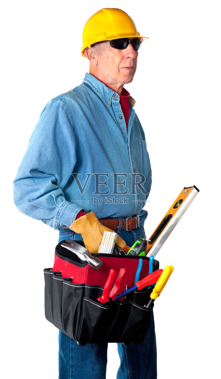 戴安全帽，手持工作工具的承包商男子，孤立照片摄影图片
