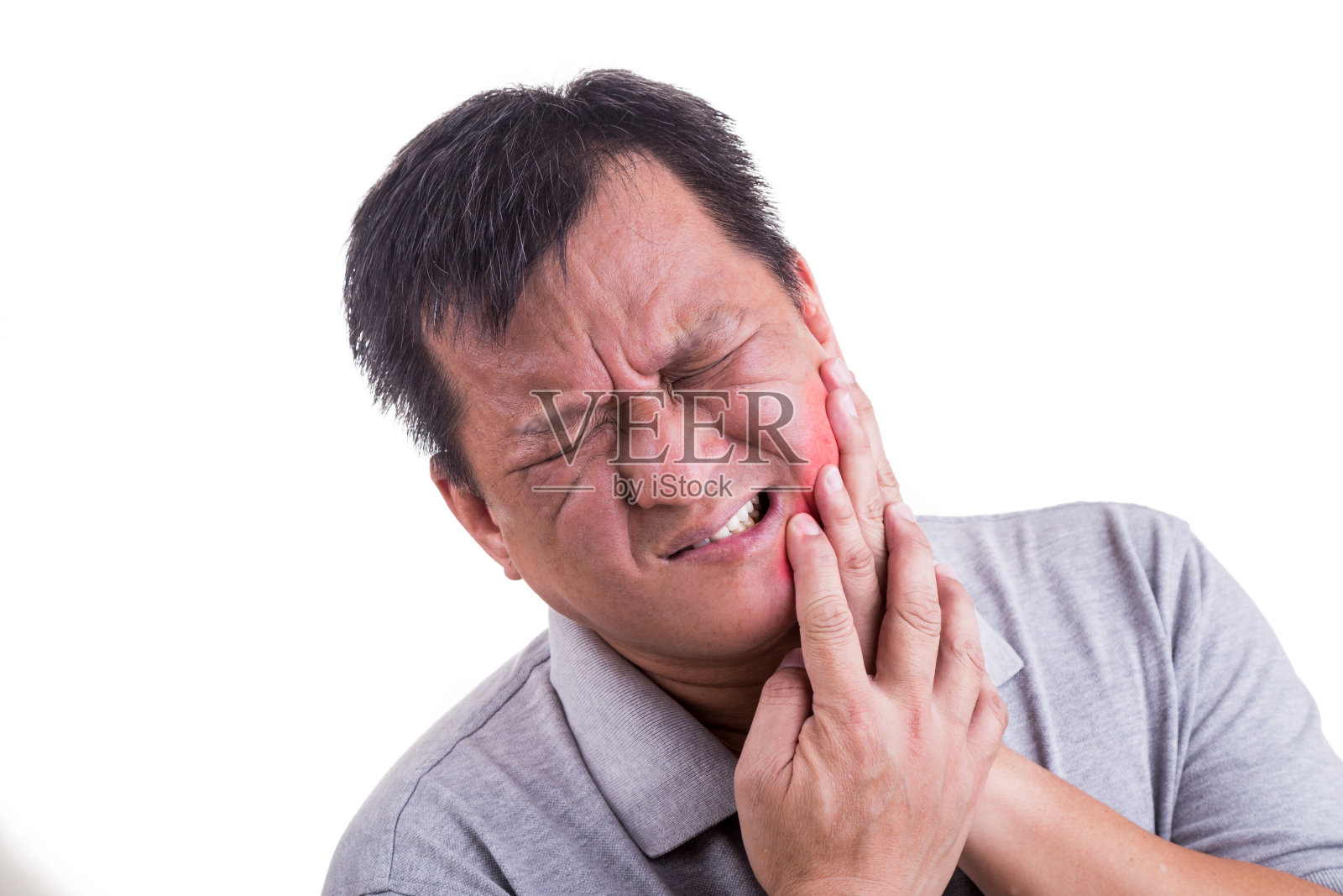 成熟的男人正忍受着剧烈的牙痛，手捂着脸照片摄影图片