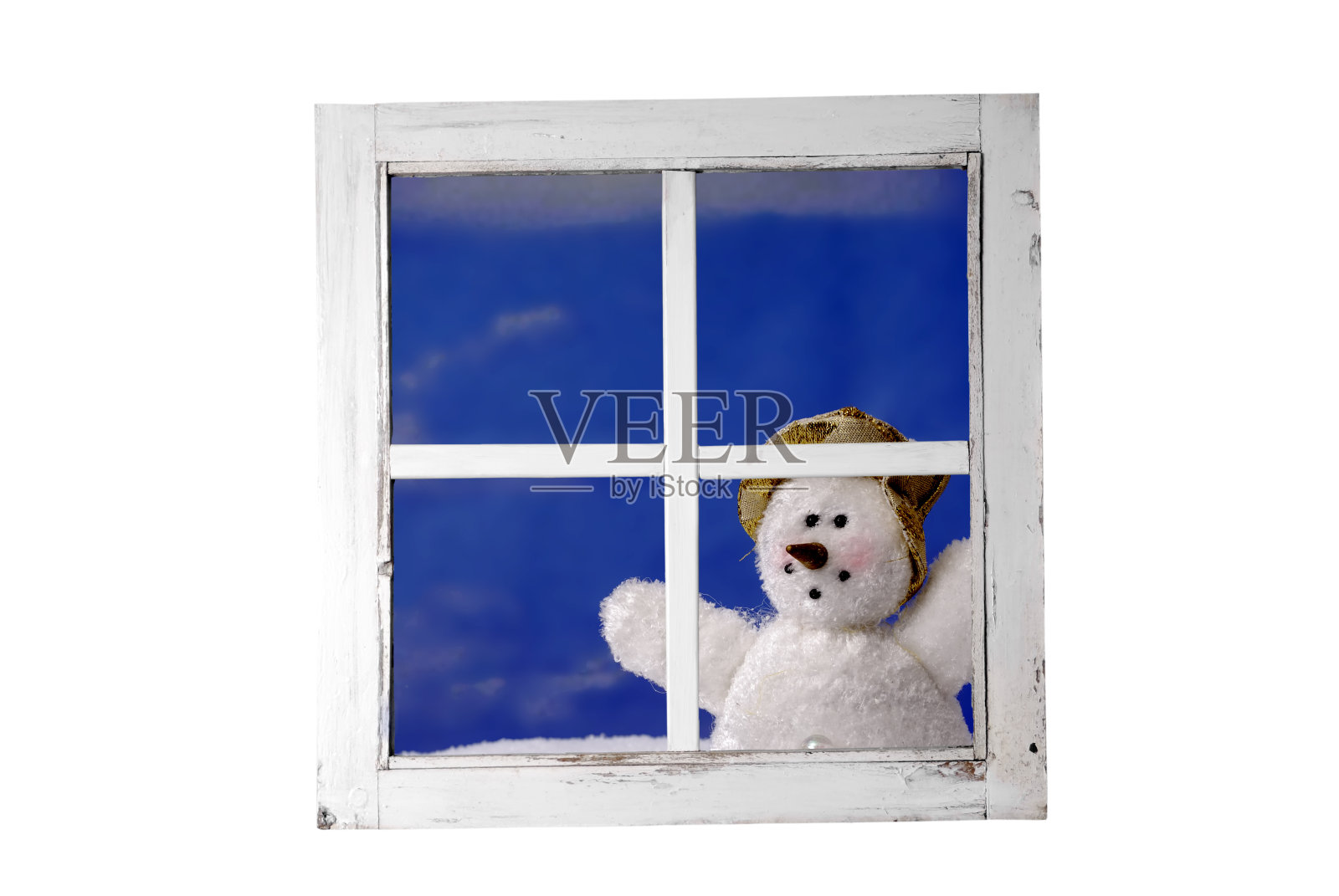 雪人透过窗户看照片摄影图片