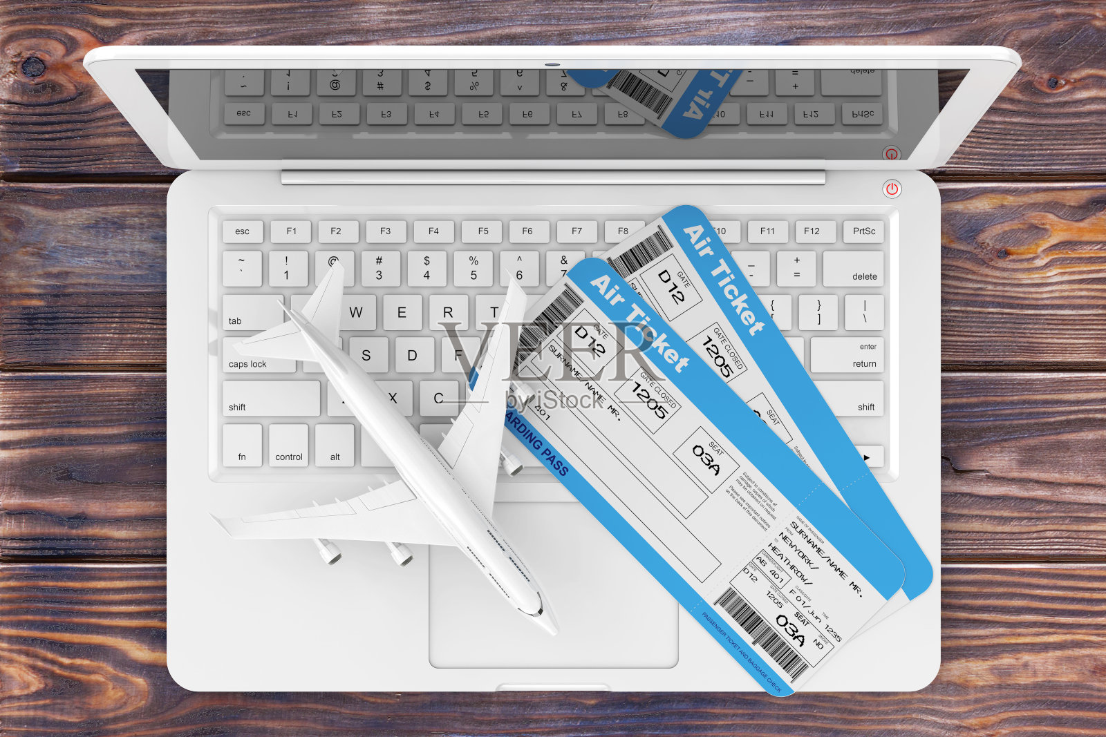 在线预订的概念。航空登机牌机票与喷气式飞机在笔记本电脑上木制桌子。3d渲染照片摄影图片