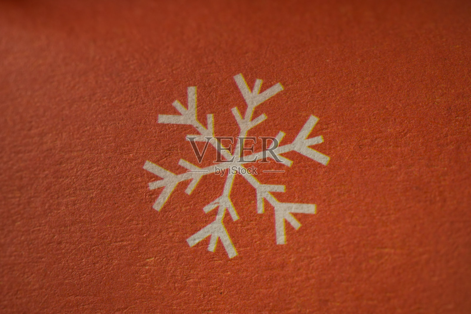 雪花-冬天或圣诞节符号在纸微距拍摄。照片摄影图片