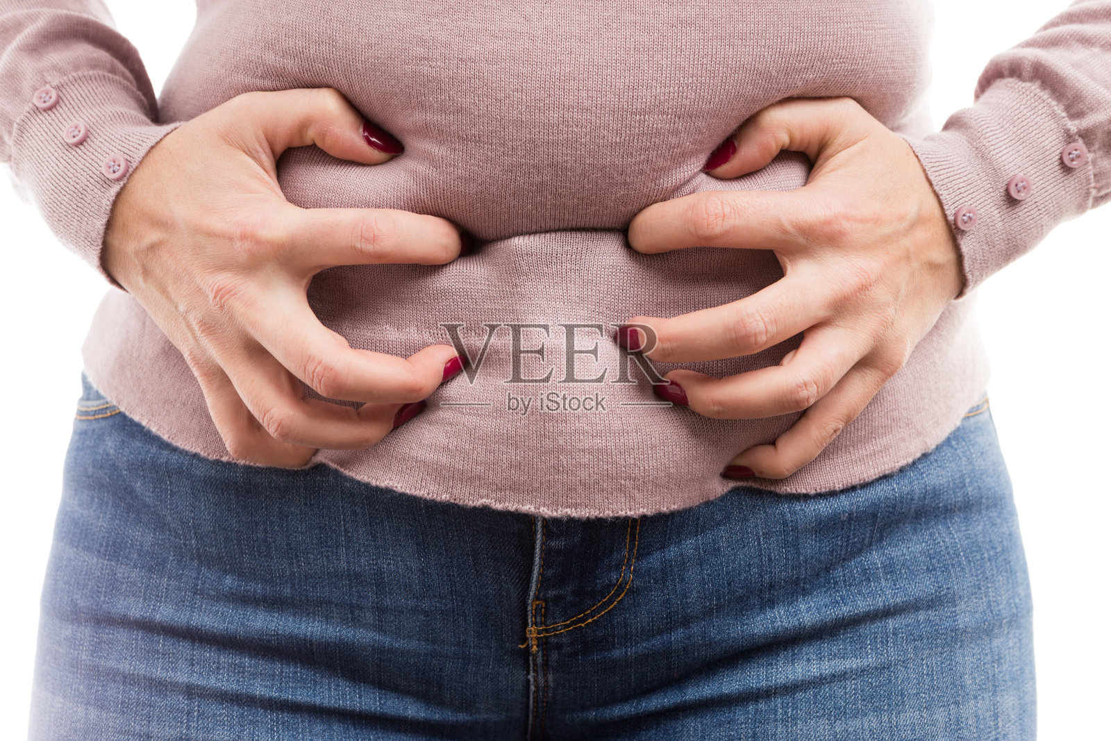一个女人抓着她的肚子说她有腹痛的问题照片摄影图片