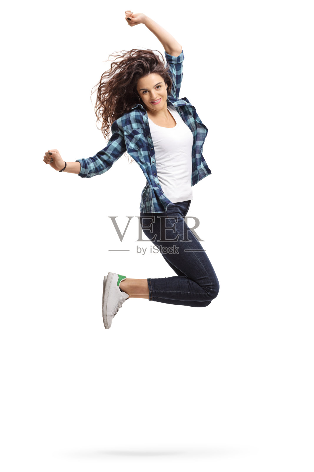 喜出望外的少女跳起来，做着幸福的手势照片摄影图片