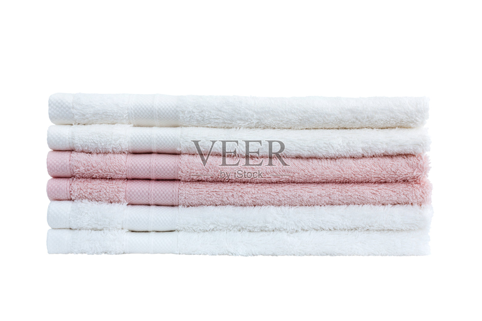 白色和粉色的浴巾堆在白色的背景上。照片摄影图片
