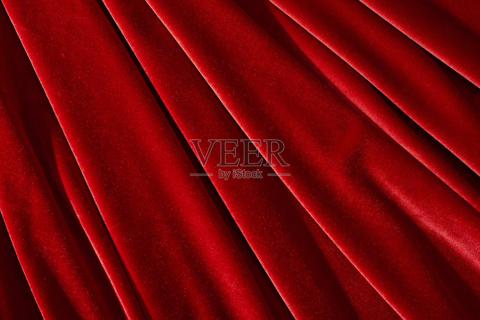 用作背景或纹理的红色天鹅绒纺织品照片摄影图片