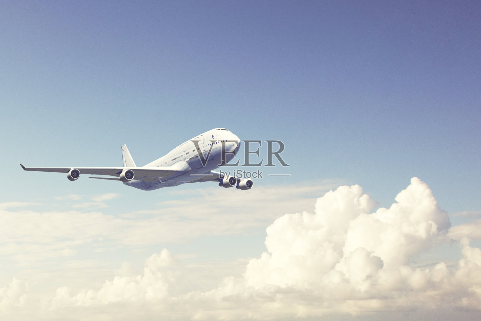 飞过云层的商业飞机照片摄影图片